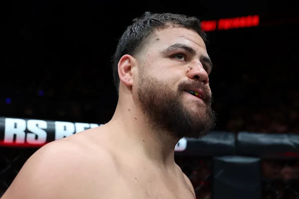 Fighter with mouthguard in the octagon