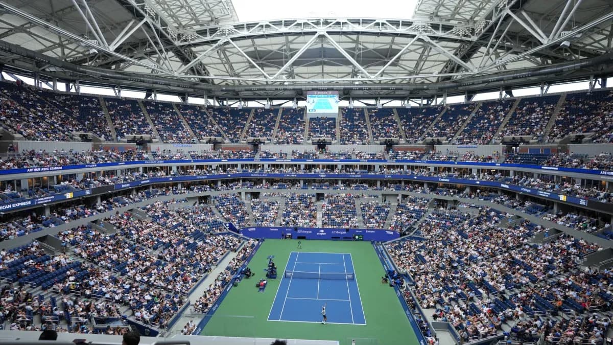 Crowd watching a tennis match at Arthur Ashe Stadium