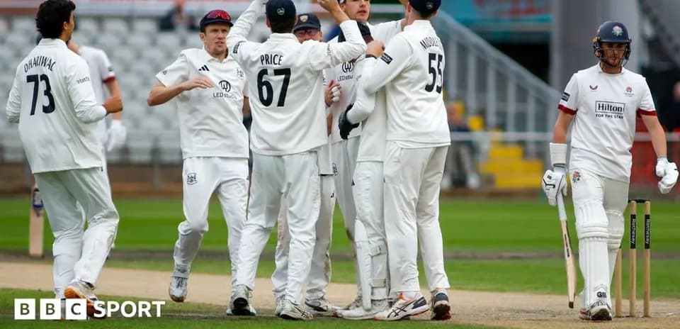 Players celebrating a wicket during cricket match
