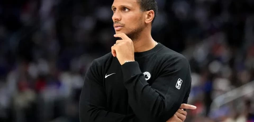 Coach observing game from sidelines during match