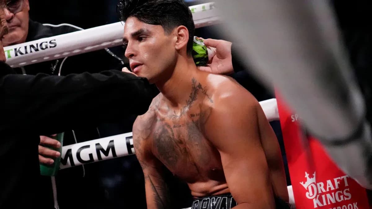 Boxer receiving assistance in corner of ring