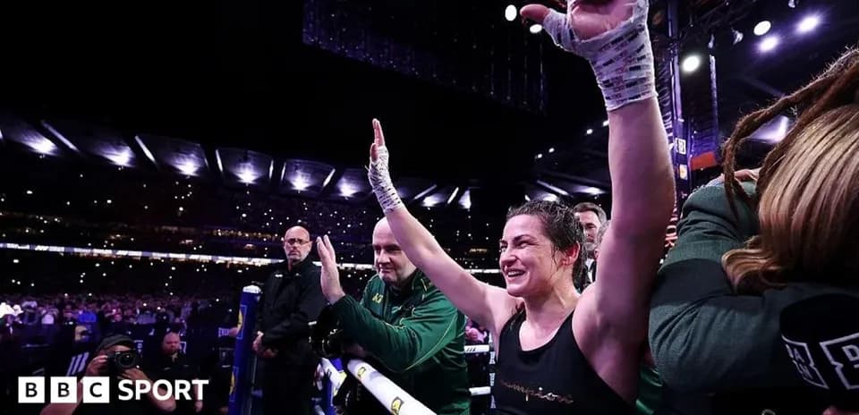 Female boxer celebrating after match in arena