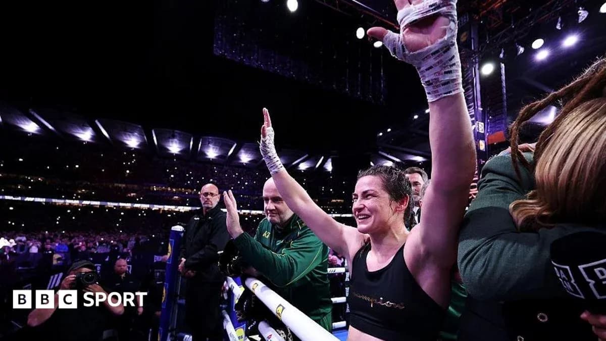 Female boxer celebrating after match in arena