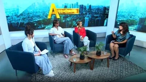 Four women discussing on a television talk show