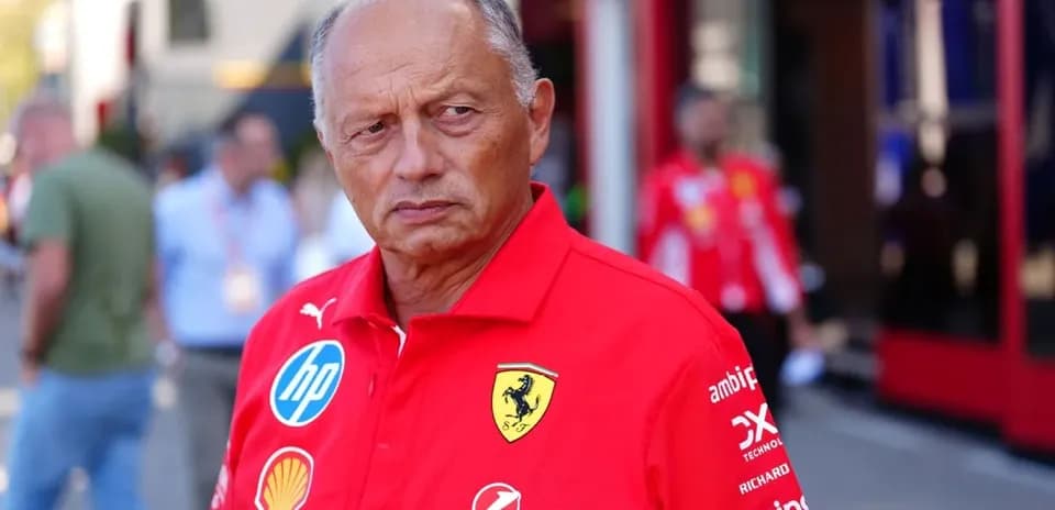 Team principal in red Ferrari shirt at event