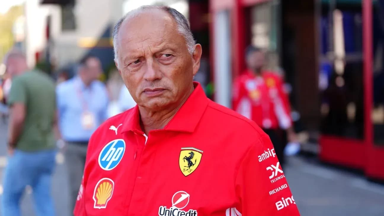 Team principal in red Ferrari shirt at event