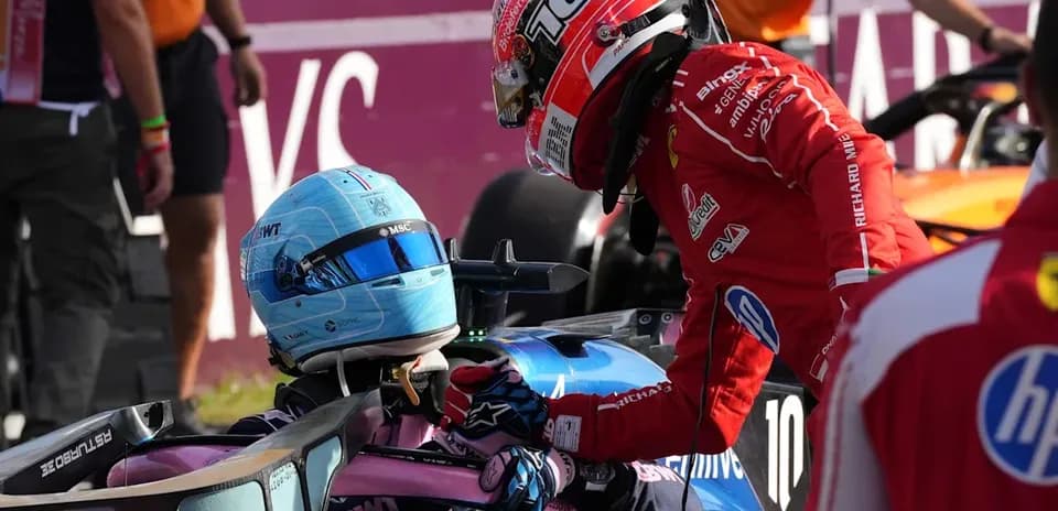 Drivers interacting after a race incident in paddock