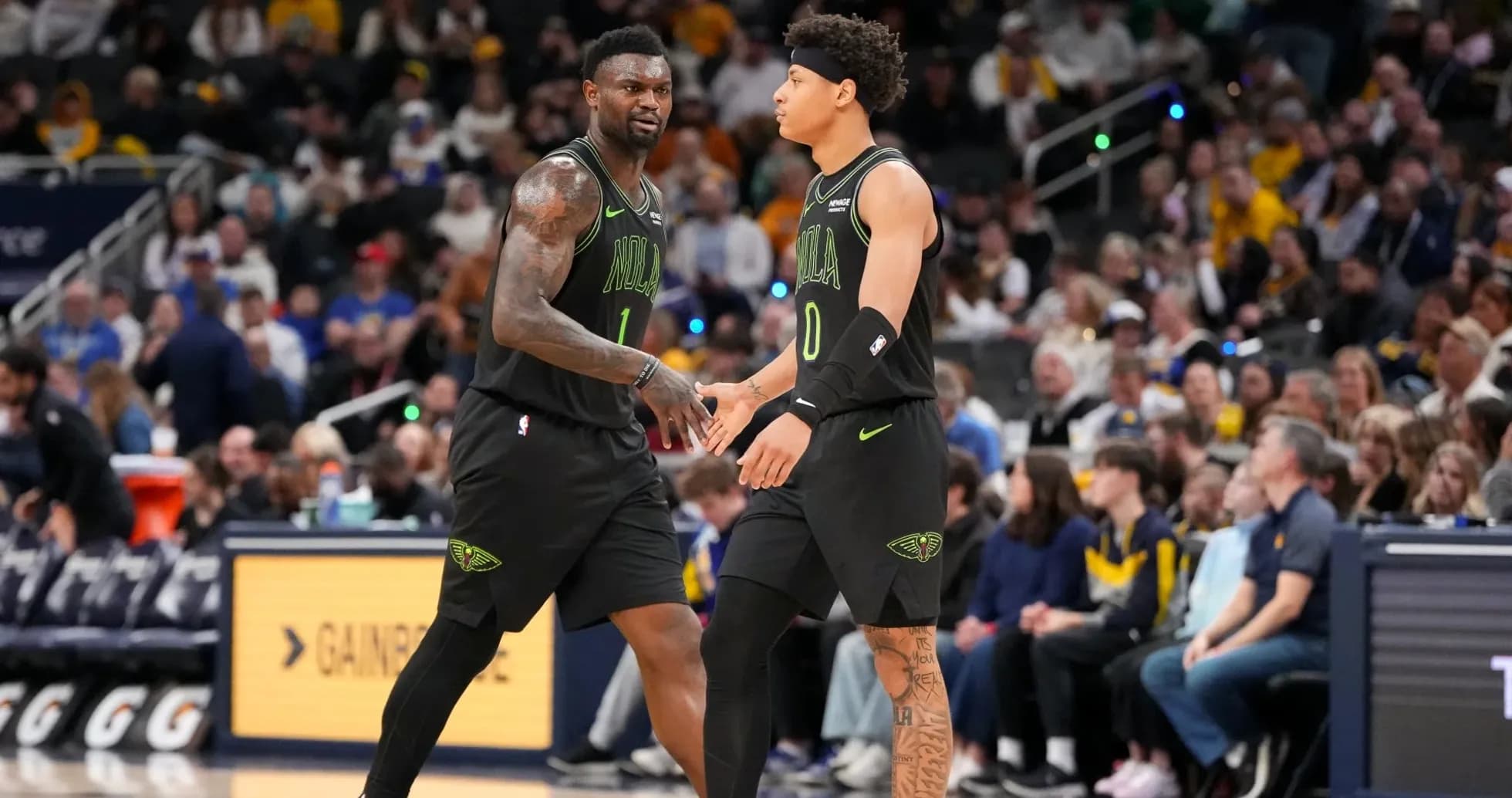 Two players exchanging a handshake on court