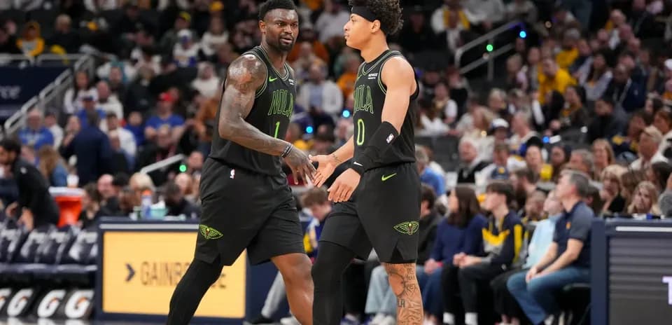 Two players exchanging a handshake on court