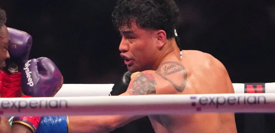 Boxer delivering a punch during a match
