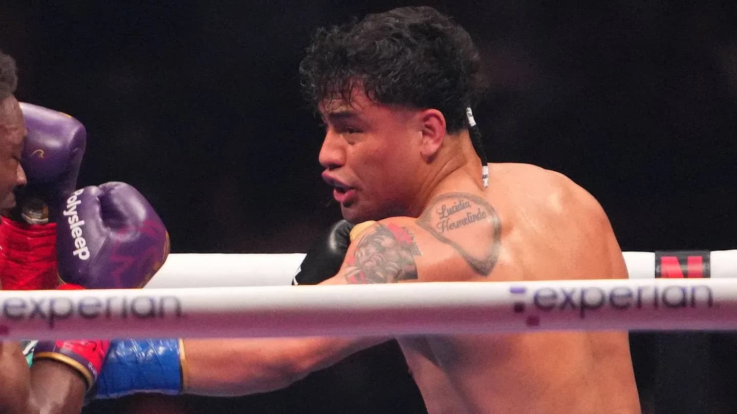 Boxer delivering a punch during a match