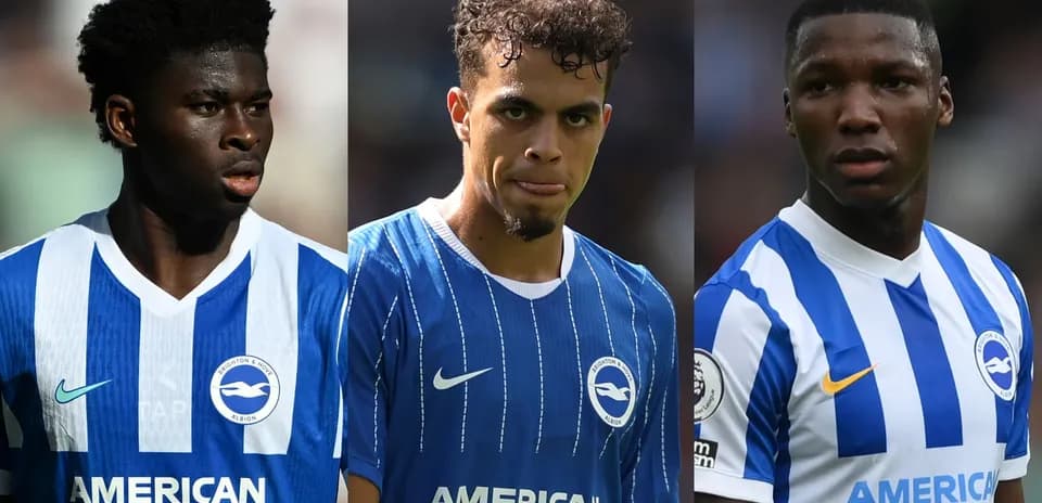 Three Brighton players in blue jerseys during match
