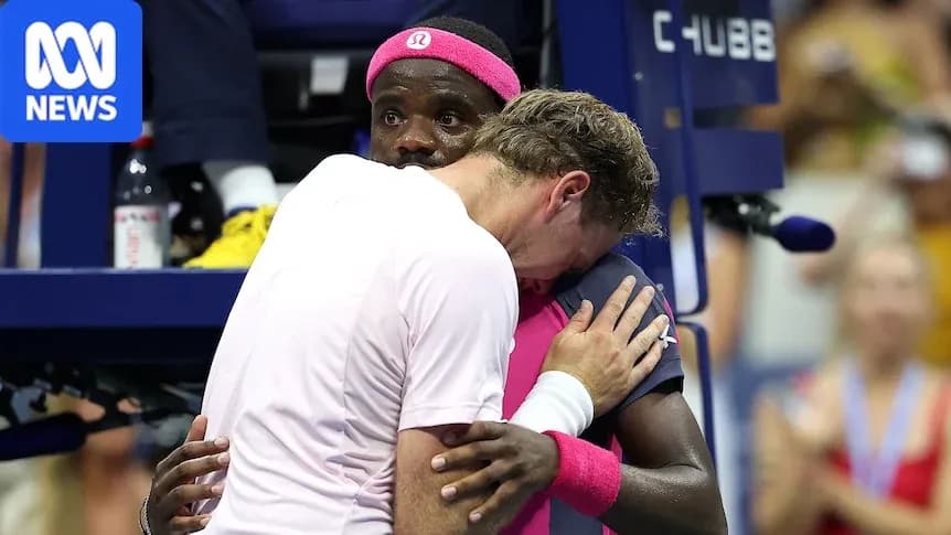 Two tennis players embracing during a match