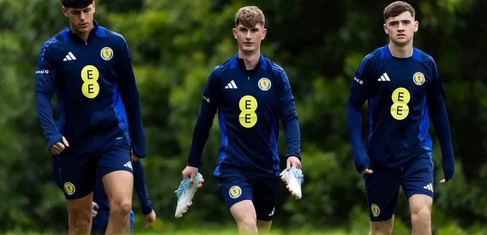 Three Scottish players walking during training session