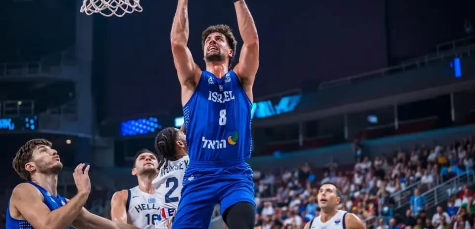 Player from Israel making a slam dunk during game