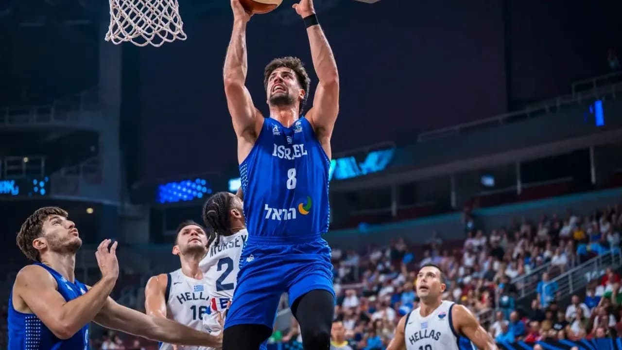 Player from Israel making a slam dunk during game
