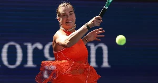 Player hitting a tennis ball during match