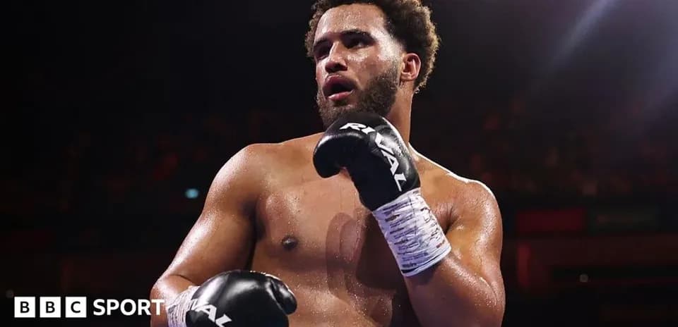 Boxer in gloves posing during a match