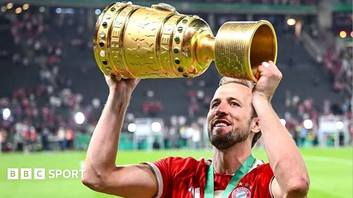 Player celebrating with trophy after match victory