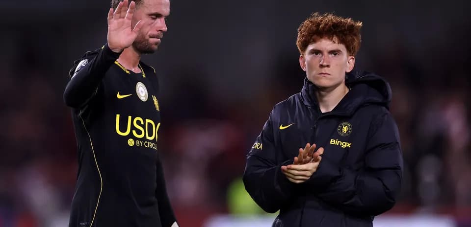 Two players acknowledging fans after the match