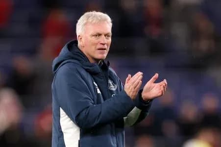 Manager clapping during a football match