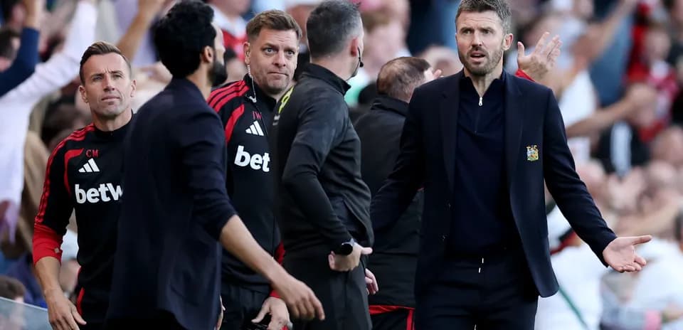 Coaching staff reacting during a tense match