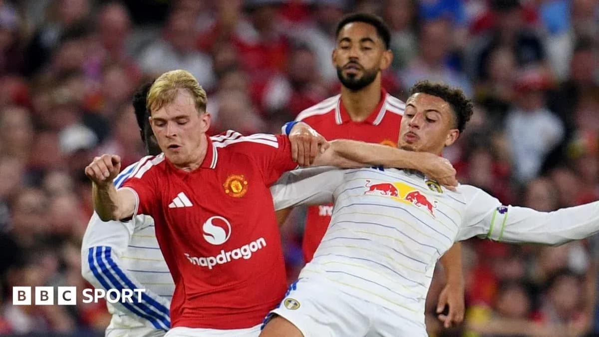 Two players challenging for the ball during match