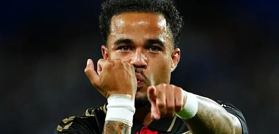 Player celebrating with clenched fists after a goal