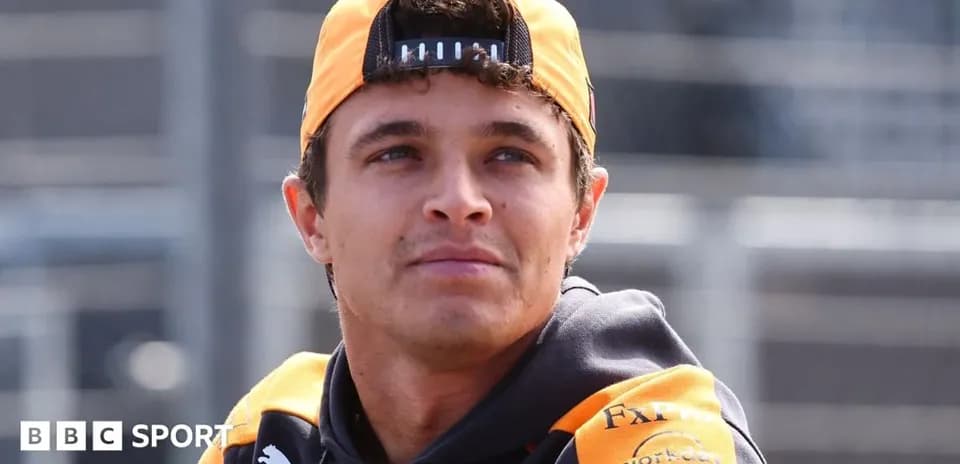 Driver wearing McLaren gear at the racetrack