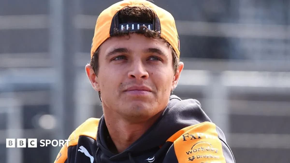 Driver wearing McLaren gear at the racetrack