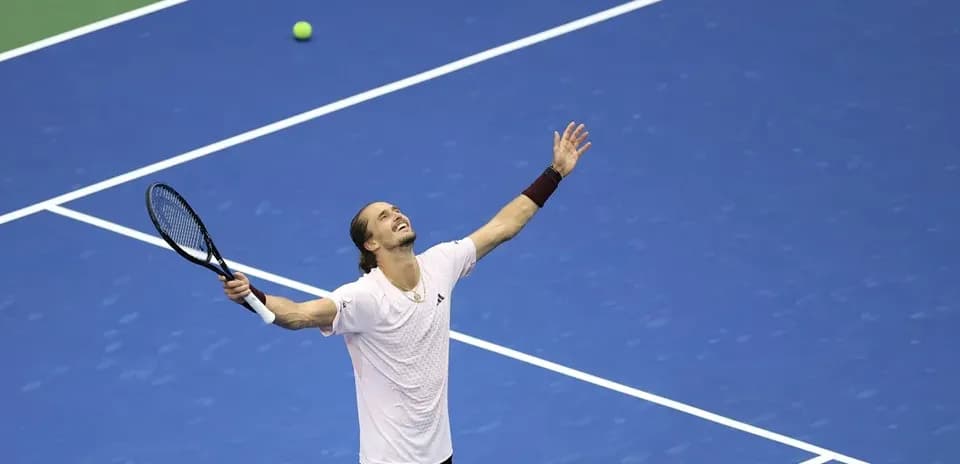 Player celebrating after winning a tennis point