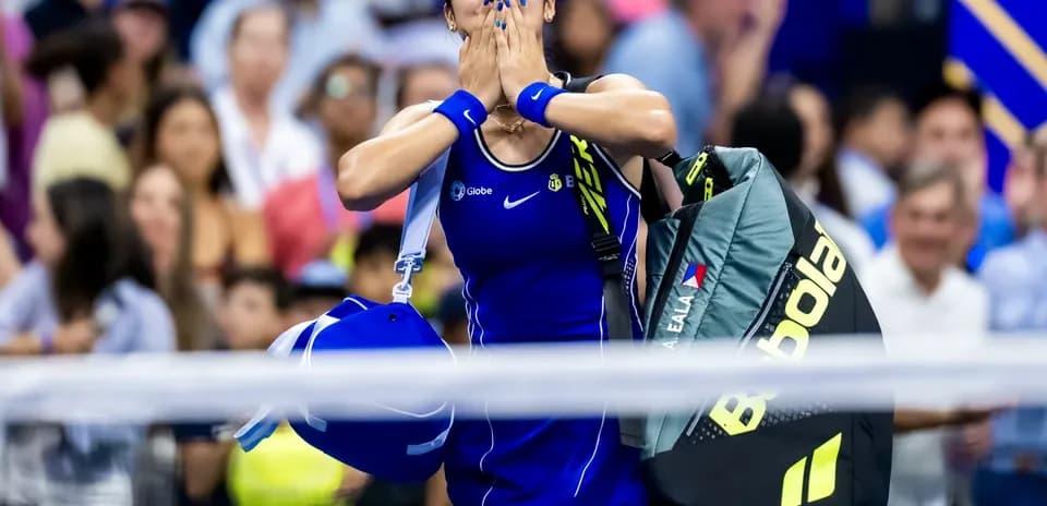 Tennis player celebrating while leaving the court