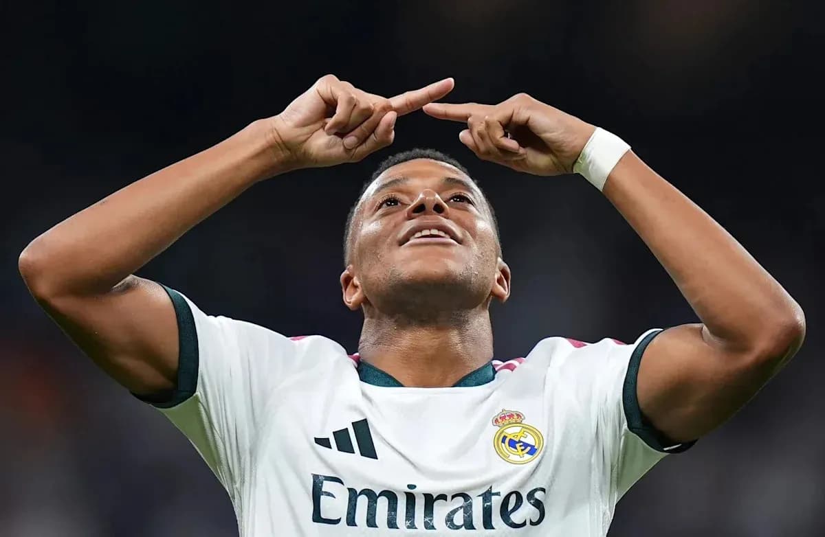 Player celebrating a goal with arms raised