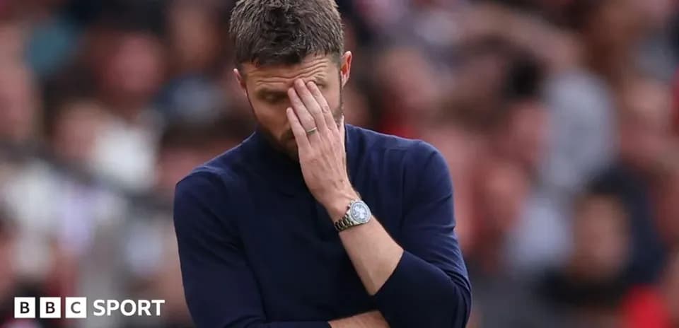 Coach looking concerned during a match