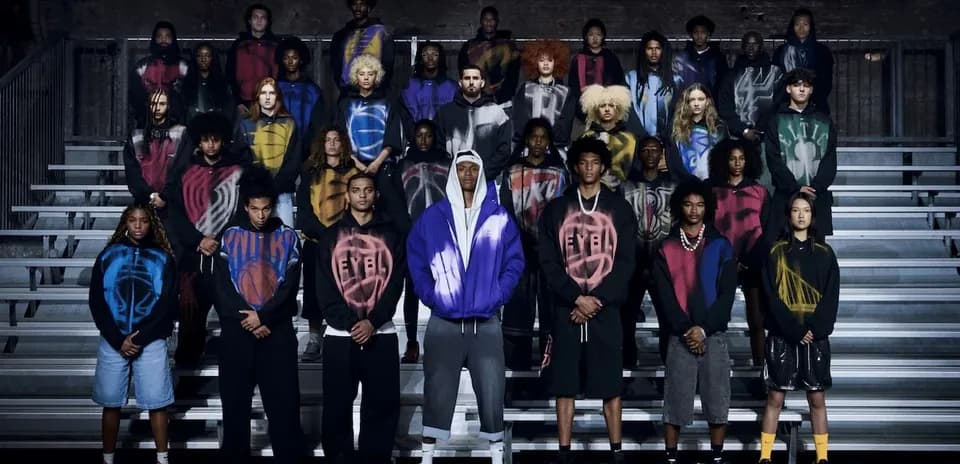 Group of young athletes posing in colorful hoodies