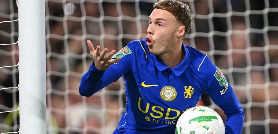Player gesturing while holding ball during match