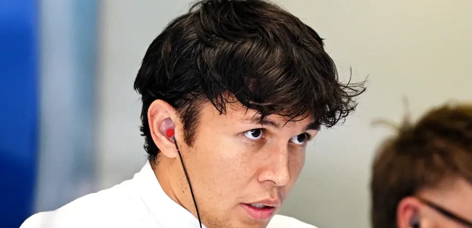 Driver wearing earbuds during a team meeting