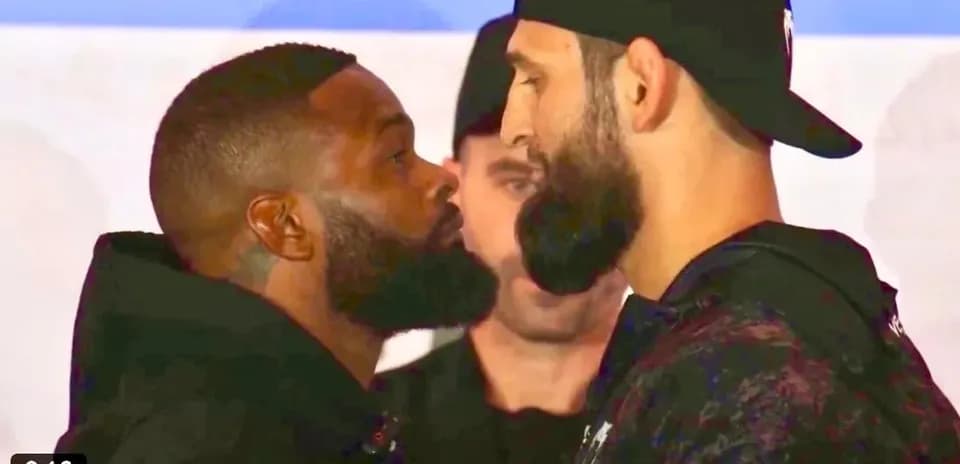 Two fighters facing off during press event