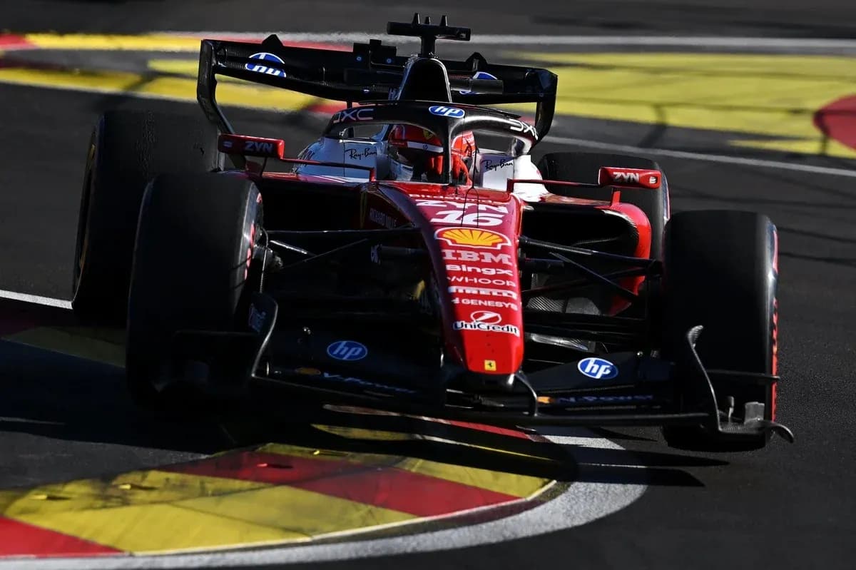 Ferrari F1 car navigating a corner on track