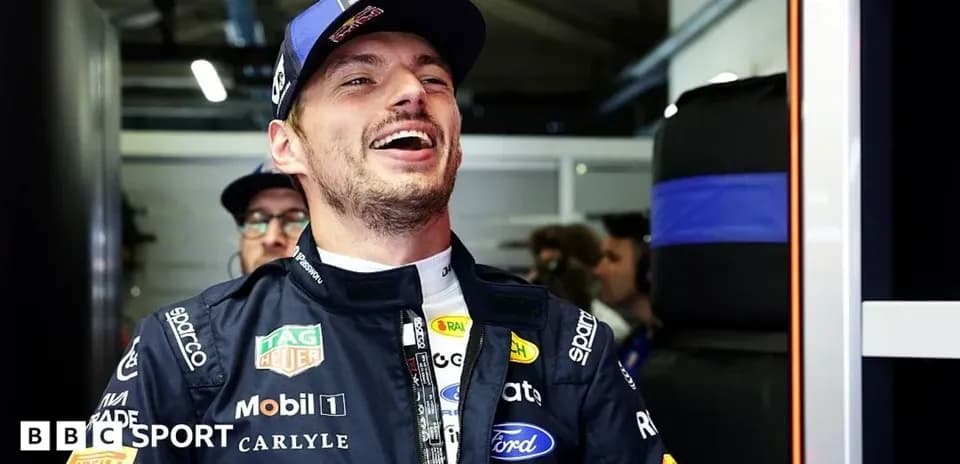 Driver smiling in the pit area during event