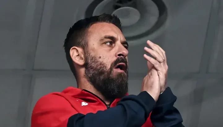 Man applauding in a sports venue