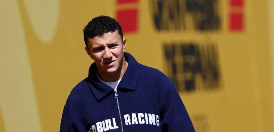 Young man in Red Bull Racing jacket outdoors