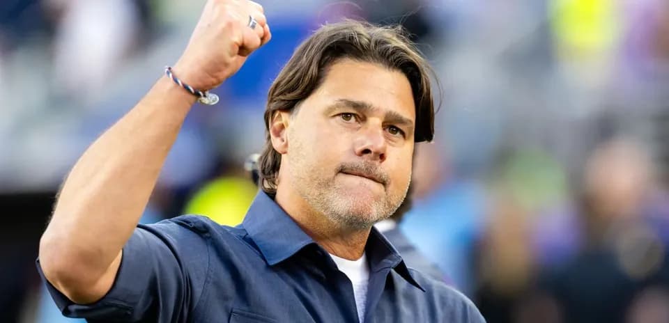 Coach celebrating with fist raised during game