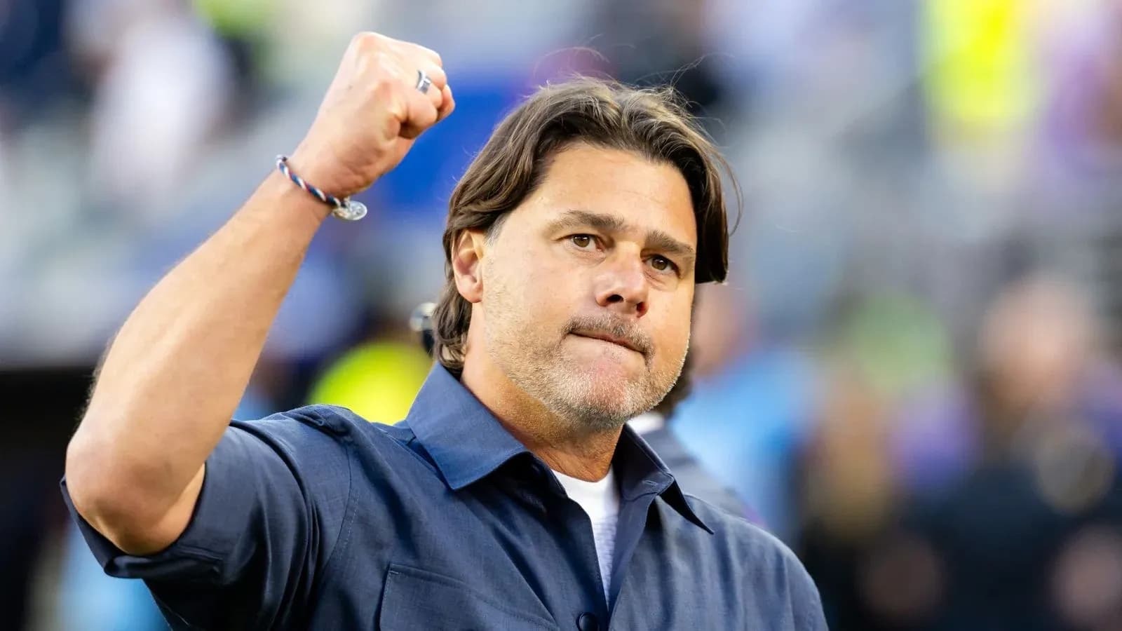 Coach celebrating with fist raised during game