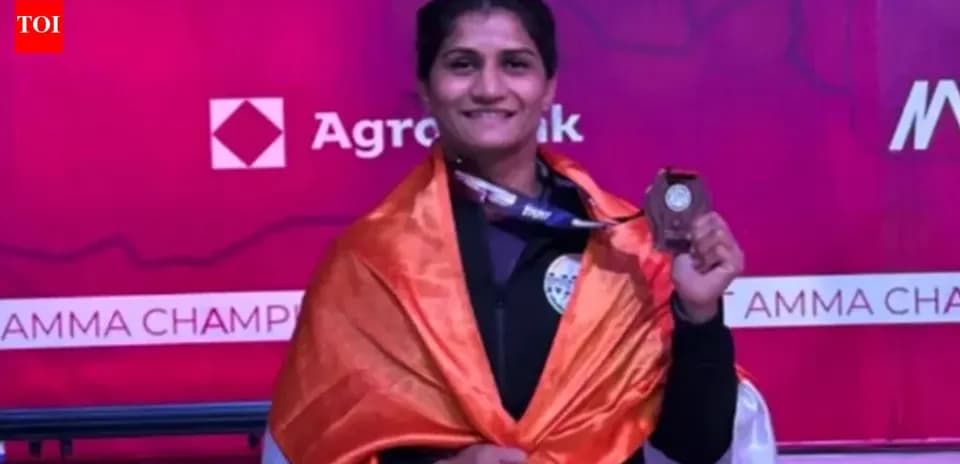 Athlete holding medal and draped in flag
