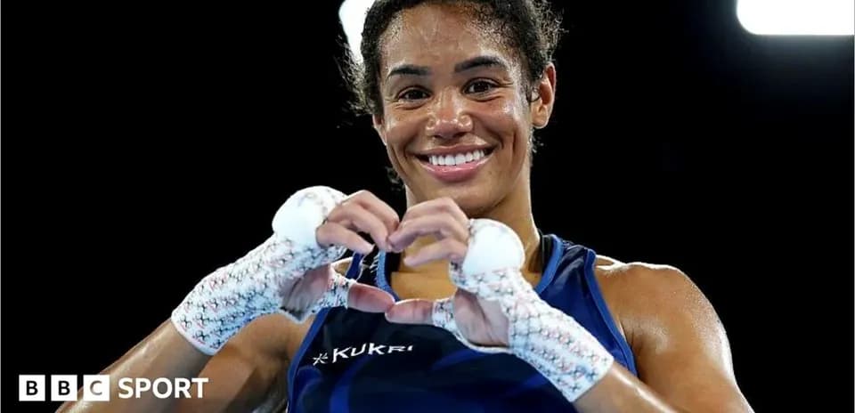 Boxer making heart shape with hands after match