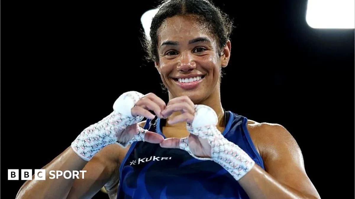 Boxer making heart shape with hands after match