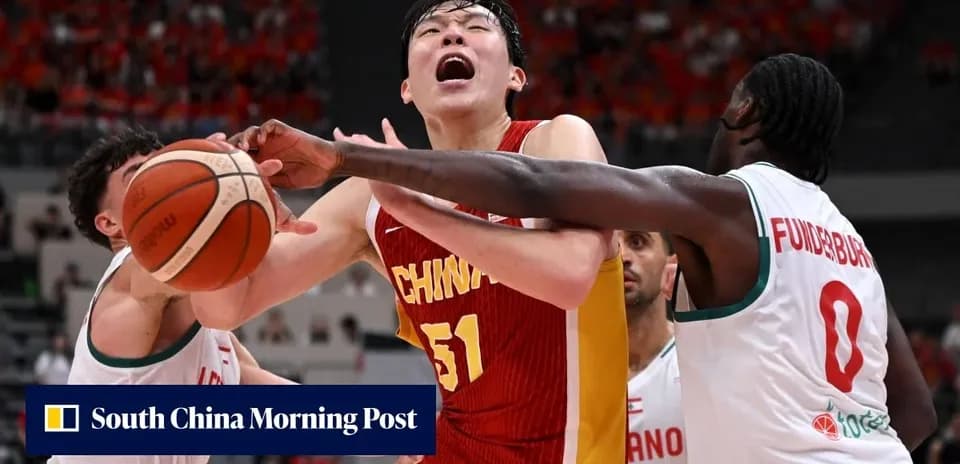 Player from China contested by two opponents for the ball