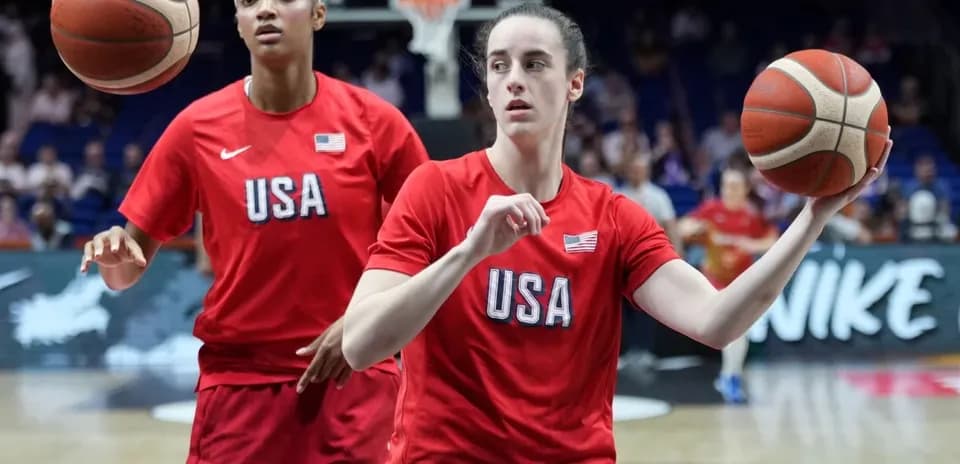 Two players warming up with basketballs on court