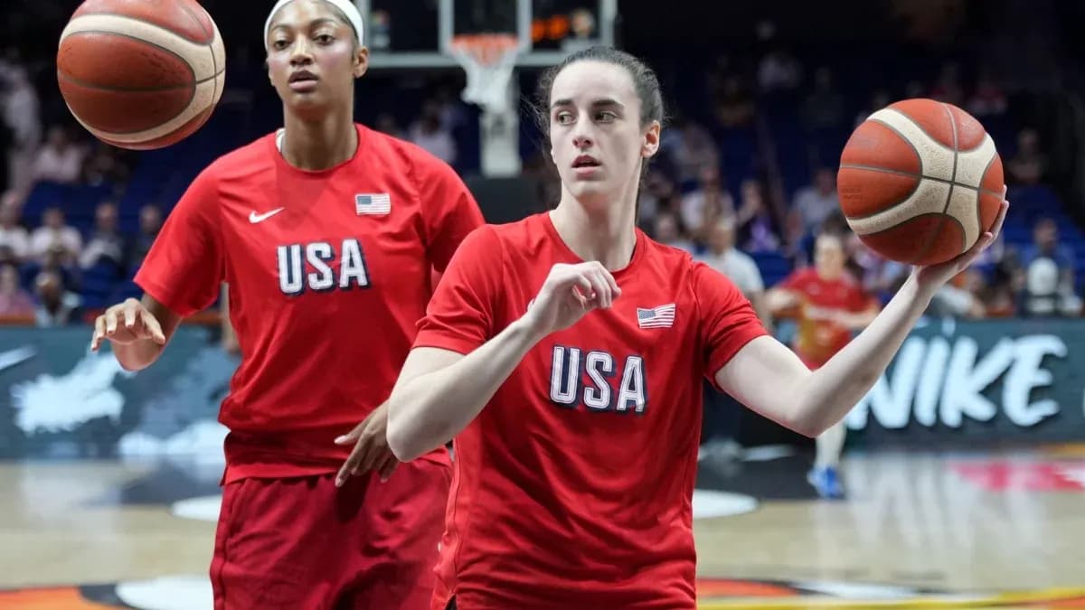 Two players warming up with basketballs on court